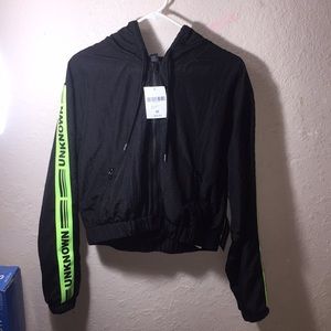 Sweater slime green with the word unknown on it